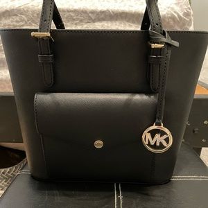 black michael kors bag, never used! perfect amount of space!